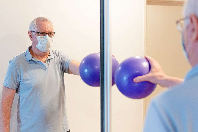 A man performing neuromuscular activation treatment exercises