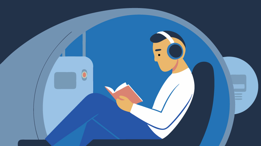 man-in-hyperbaric-chamber man sitting in a hyperbaric chamber reading a book